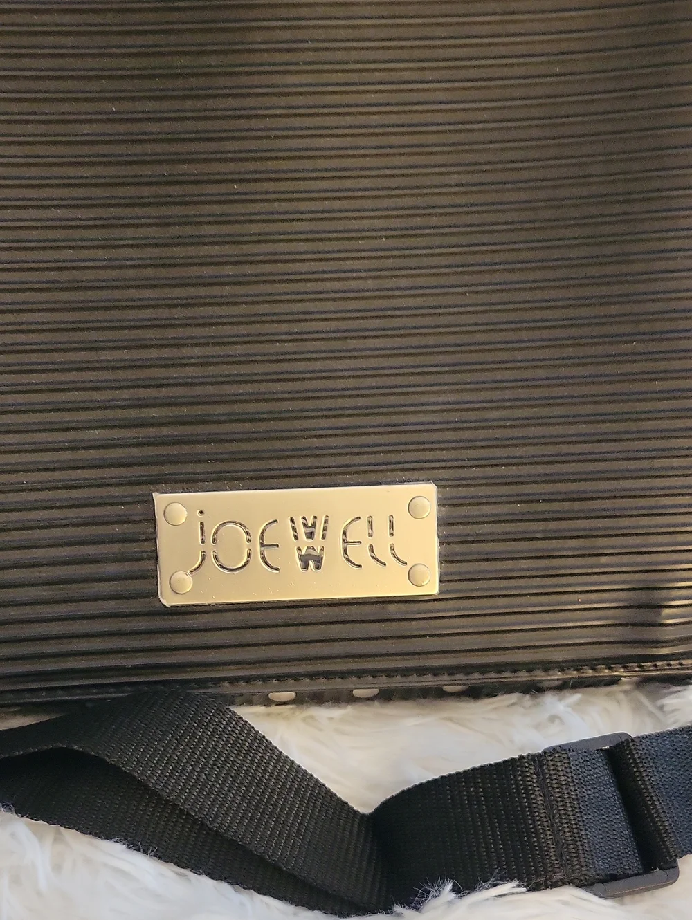 JOEWELL Black Ribbed Crossbody Bag There Is A Cut On Each Side Of The Flap.